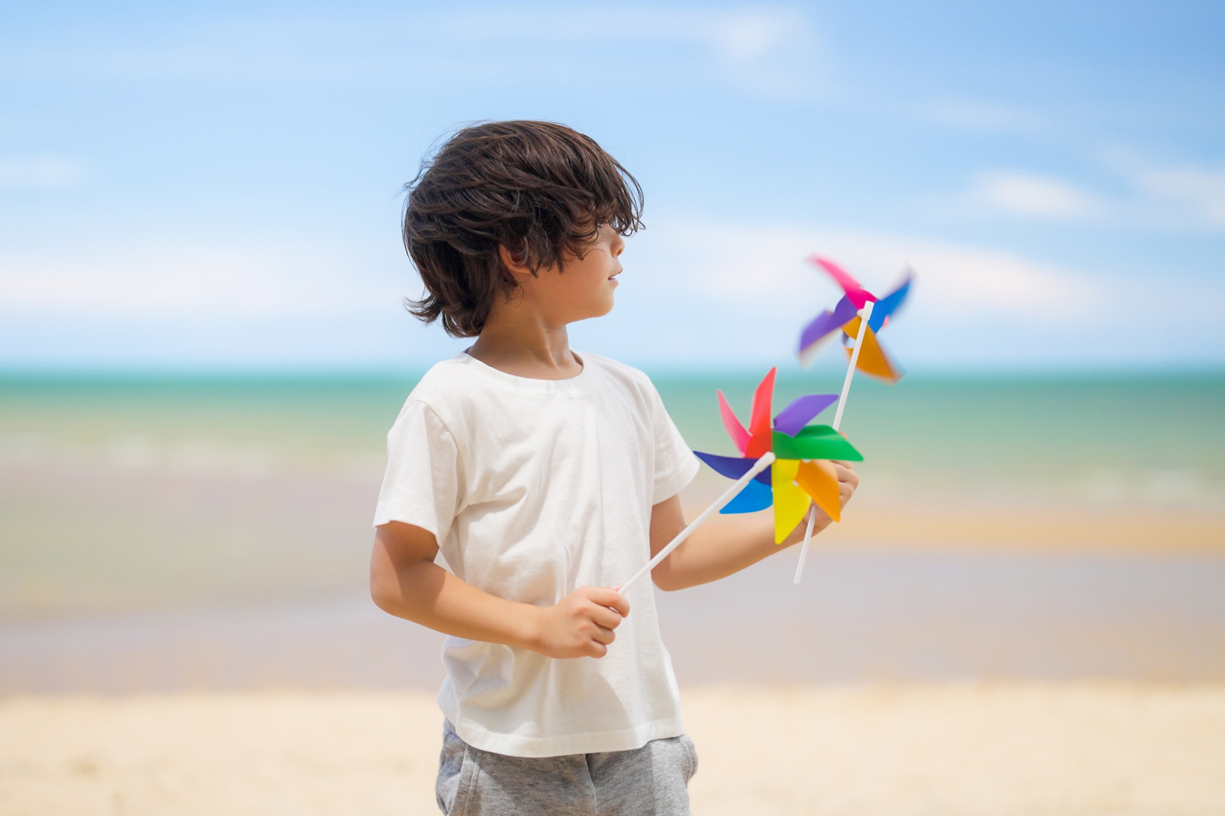 Happy boy playing and running on beach, Summer beach travel